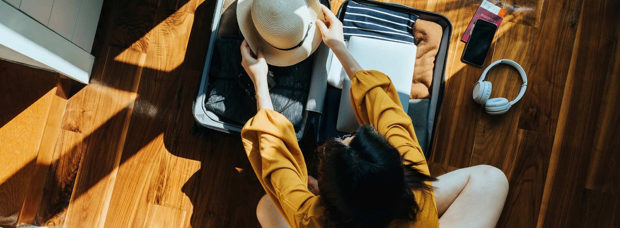 Traveller packing suitcase