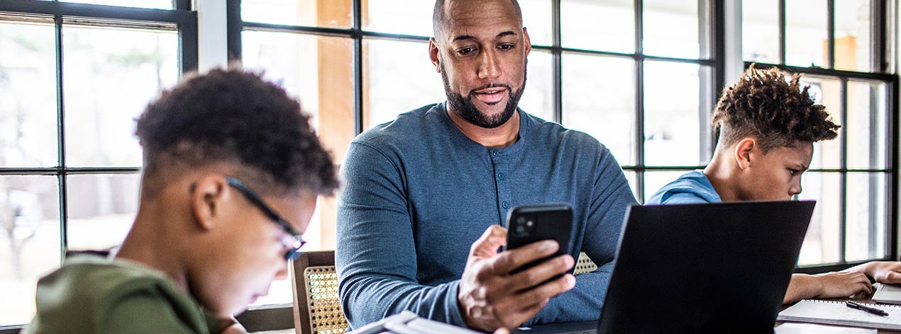 Family checking travel plans online