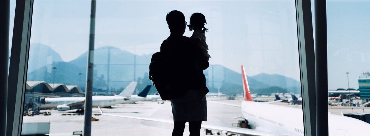 Parent and child waiting in airport